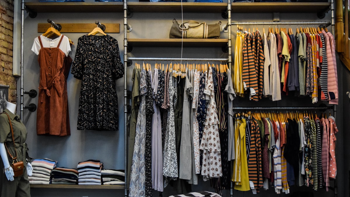 Freshly fitted clothing store with full, tidy racks