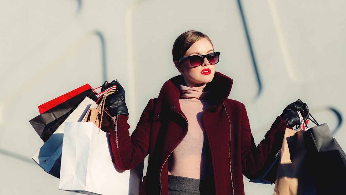 Shopper loaded with bags during a sales and promotions period