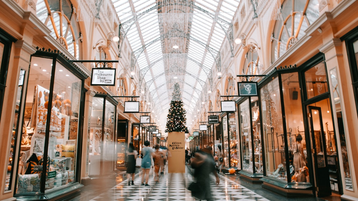 A busy shopping arcade with people walking through