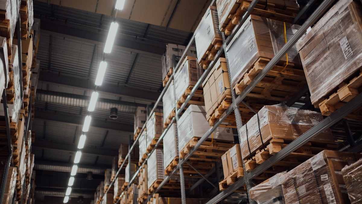 Stockroom racking loaded with boxed goods on pallets