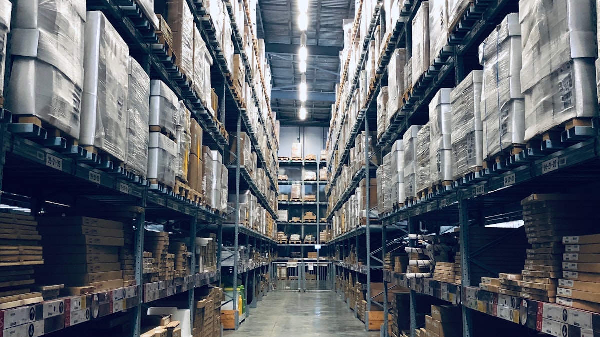 Stockroom aisle with shelving stacked full of boxes