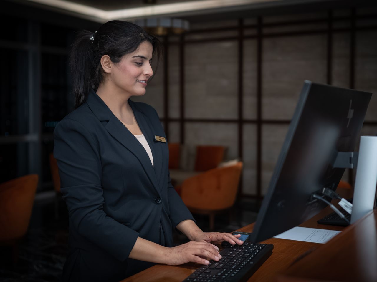 Receptionist in uniform at the front desk